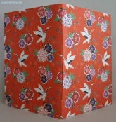 Geschenkpapier Kranich & Blumen auf Orange